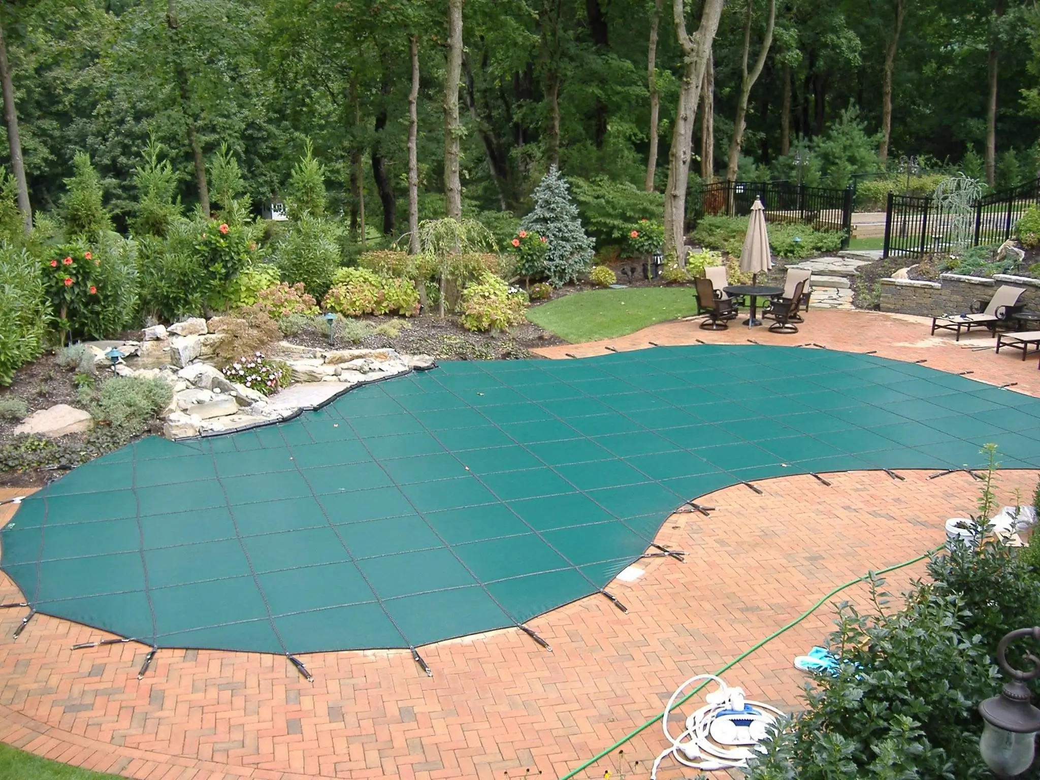 Green mesh safety cover for in-ground pool